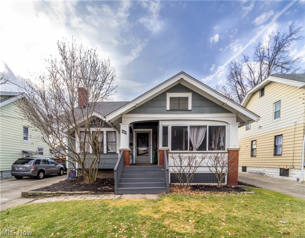 This beautiful 1.5 story bungalow is waiting for you! Move-in ready with many updates! This home features an inviting enclosed front porch, spacious living room with a gas fireplace and formal dining room. New laminate wood flooring in living room, dining room and updated kitchen. There are two bedrooms (with original hardwood floors) and full bath on the main floor. The second floor features a spacious master bedroom, second full bath and bonus loft area. The lower level is a full, unfinished basement with an enclosed storage room and laundry area. Central air, 2-car detached garage (wired for garage door opener), fenced back yard. Updates include: New roof (2015), new furnance (2014), new wood laminate flooring in living room, dining room and kitchen (January 2020), freshly painted last year, updated kitchen with new countertops, electrical and outlets. Stove and refrigerator included with sale, washer and dryer are negotiable. Comes with one-year America's Preferred Supreme Home War