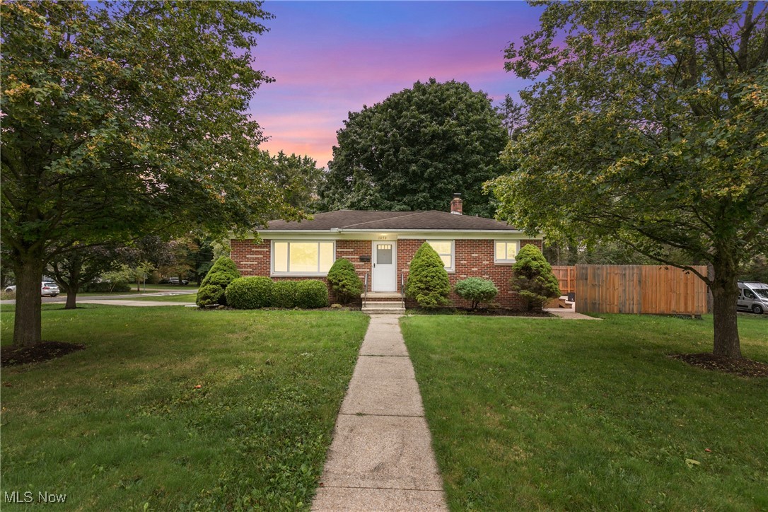 Located in Kent, Ohio, this Ranch-style home offers an excellent location. It's situated near the Portage Hike & Bike Trail and the Cuyahoga River, providing easy access to these amenities. The property is also conveniently located across from Longcoy Elementary, which includes a large playing field and playground. In addition, the home is just one mile away from Fred Fuller Park and provides convenient access to downtown Kent. The first floor features a bright and welcoming hardwood living room, while the lower level includes a 300 sq. ft. walk-out family room. All bedrooms are hardwood under carpeting. Updated and freshly painted bath (new LVT flooring 9/24!) . The outdoor space on the west side of the property has a sizable patio (20x29) put in < 2 years ago, enclosed by a full privacy fence, perfect for outdoor gatherings! Improvements include replacement windows, a new dishwasher (installed in 9/2024), beautiful hardwood floors, a new washer (1 year old), central AC (2 years old), and a dryer (5 years old). Both washer/dryer are included! The roof and water heater are estimated to be 12 years old. Carpet recently cleaned professionally. Don't miss the opportunity to see this beautiful home and submit your highest and best offer!