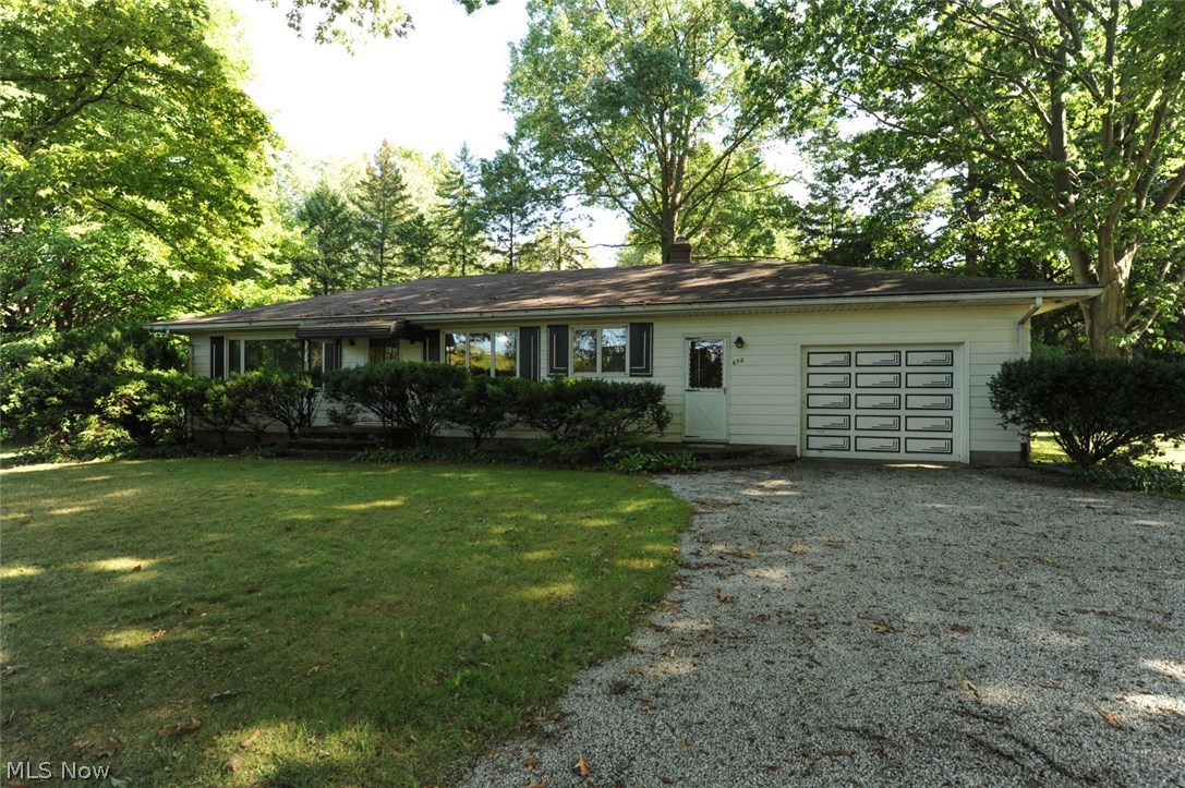 Wooded retreat, right here in Coventry!  This beautiful ranch has maintained all it's original charm.  Awesome retro kitchen with all of the cabinets and counters in mint condition.  Yes, the counter top oven with pull out range works!  The large kitchen has counter top seating and opens up to a dining area that will fit a full size dining set. Built in cabinets in dining area are just right for cans and spices, and the kitchen has a large closet that could be used as a pantry or coat closet.  Gorgeous original hardwood floors begin in the living room and go through hall and bedrooms.  Three very nice sized bedrooms have large closets.  The full bath has tons of counter space and updated tub/shower.  The full basement with tall ceilings is perfect to be finished!  The 2nd bath is located in the basement.  All pieces are functional, just needs enclosed.  Updated furnace, hot water heater, and electrical.  Entire basement waterproofed in 2007, Humidex ventilation system installed 2011. A