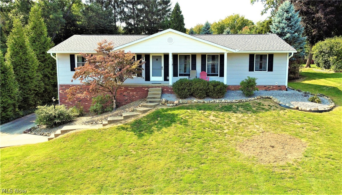 MUST SEE RANCH HOME WITH A PARK LIKE LOT IN NORTH CANTON - This must-see home has an updated Kitchen with premium wood cabinets, drawer glides and storage galore, solid surface quartz counter tops and updated Appliances that stay. The Kitchen has great wood floors and a bar seating area for meals. The charming Family Room features a brick Fireplace with wood mantel and a walk-out to a large covered porch. The open Living Room features updated windows and new premium carpeting. Dining Room has plenty of room with new ceiling fan and new flooring. Home has (3) large bedrooms with big closets. Master Bedroom has new flooring, new closet doors and there is an updated must-see Full Master Bathroom. Basement has a finished Rec-Room with wainscoting and trim work. There is a Full Bathroom in Lower Level with vanity, toilet and oversized jetted garden tub. Home has (3) Full Bathrooms - wow! There is a large (2) Car Garage with lots of built-in storage and opener. Home has a covered Front Porch