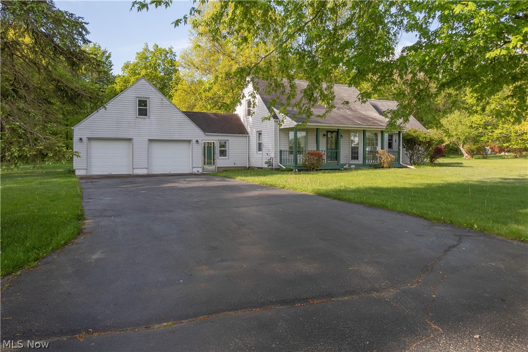 Large 4.1 acre beautiful country setting has a pond, shop, shed, and 3 bedroom house. large living room with bay window and French doors to a deck, eat-in kitchen with cherry cabinets and ceramic flooring. Formal dining room. 2 bedrooms upstairs and a first floor master. Full basement. Home has a breezeway/mud room connecting the house to the garage. Home warranty included. Call today!