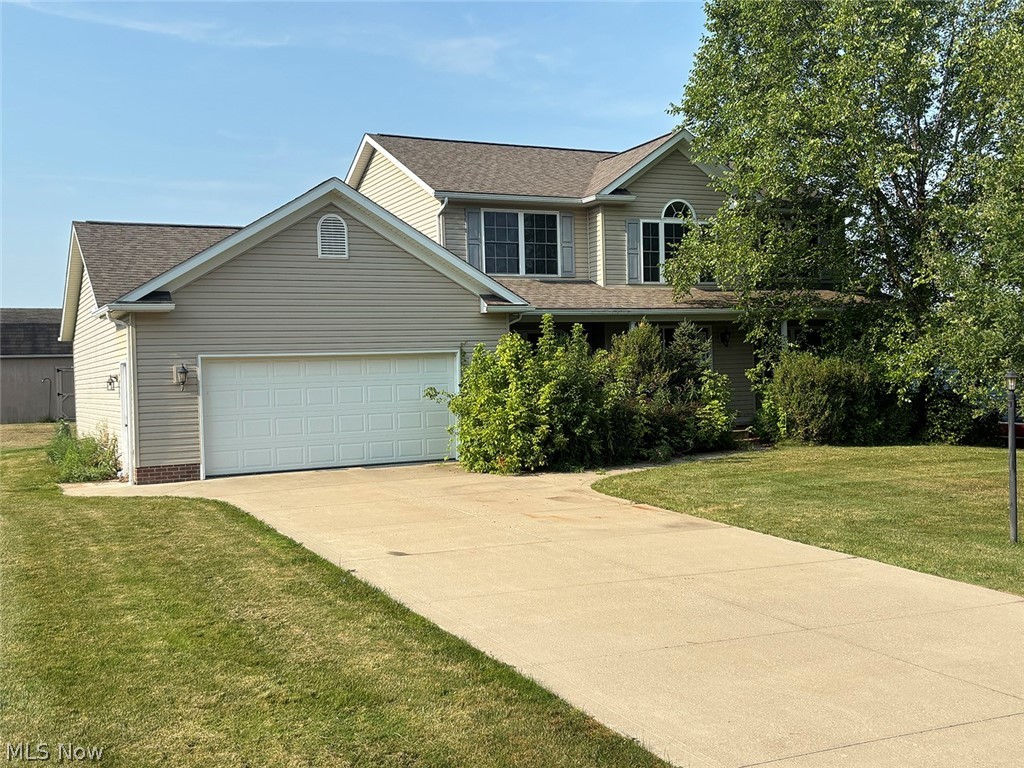 Ideal Homeowner or Investment Opportunity - Lake Schools - Take a look at this 4-bedroom, 2.5-bath Colonial home built in 2006, offering 2,200 square feet of living space. The main floor features a large kitchen with appliances, a formal dining room, a spacious living room with a gas fireplace, main-floor laundry, and a half bath. Upstairs, you’ll find a large owner’s suite with a walk-in closet, double vanity, step-in shower, and soaking tub. Three additional bedrooms and a full bath complete the second floor. Outside, enjoy the covered front porch, large concrete patio, concrete driveway, low-maintenance vinyl siding, and a storage barn for extra space. Whether you’re looking for a place to call home or a great investment property, this home has plenty to offer. Spacious rooms, a practical layout, and a convenient location to all of the Hartville shops and Marketplace.