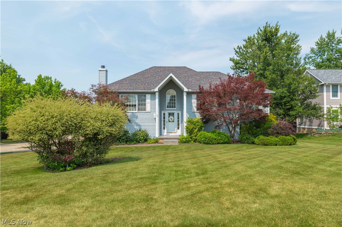 Welcome to 14122 Ashley Lane, on a quiet cul-de-sac in the desirable Ashley Woods community of North Royalton. This beautifully maintained 3-bedroom, 3 full-bath home offers a spacious layout, thoughtful updates, and a nearly half-acre corner lot. Step inside to a soaring foyer that opens to the main living area. Fresh paint and new carpet create a crisp, welcoming feel, while hardwood flooring found beneath much of the carpeting adds timeless appeal. The expansive living room is flooded with natural light from oversized windows and is anchored by a stunning brick gas fireplace, creating a warm and comfortable gathering space year-round. Just beyond, the formal dining room showcases pristine hardwood flooring and flows seamlessly into the fully renovated kitchen. Designed with both everyday living and entertaining in mind, the kitchen features white cabinetry, luxury vinyl tile flooring, stainless steel appliances, a commercial-grade, 5 burner, 36-inch range, including an additional built-in oven within the oversized island. Perfect for holiday gatherings or anyone who loves to cook.The main level also includes a full guest bath, a secondary bedroom, and a spacious primary suite with a walk-in closet and en-suite bath featuring a jetted soaking tub and separate standing shower. The walkout lower level offers exceptional flexibility including a second family room with a wood-burning fireplace, LVP, a third bedroom and a bonus room ideal for an office, gym or hobby space. A full bath, and laundry room complete this level. An attached, heated, two-car garage, and a spacious yard with aluminum planter boxes provide plenty of outdoor enjoyment. Major updates, including the roof, furnace, and central air, have all been completed since 2017. Hot water heater 2023. New Garage Door Opener 2024. Deck Painted 2024. New door bell 2024. Conveniently located near highways, shopping, restaurants, parks, and medical facilities, this move-in-ready home is one you won't want to miss.