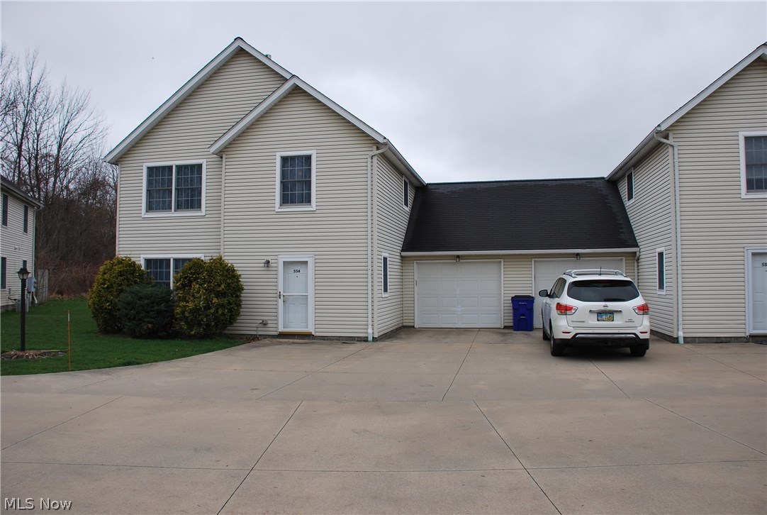 Awesome condominium w/ attached garage, windows in every room (except bathrooms & utility room of course!)! GREAT Location close to the University Hospital complex in Ravenna, easy access to Turnpike I-80 & Interstate I-76! Easy drive to the University Northeast Ohio College of Medicine and Kent State University as well as University of Akron & Akron Hospitals! This 2 bedroom PLUS LOFT unit was just built in 2000 & has been freshly painted, new carpet & laminate flooring on entire 1st floor! Furnace has easy access located on the 1st floor along w/ the new hot water tank! Attached garage w/ electric opener & keypad entry leads into the kitchen & half bath hall for easy accessibility with groceries as well as a great safety feature! Entry has a huge double closet for lots of coats & storage along w/ an additional storage closet under the steps & in the utility room. The laundry washer & dryer are located in a double closet off the kitchen for ease of use & the fully appliance kitchen ha