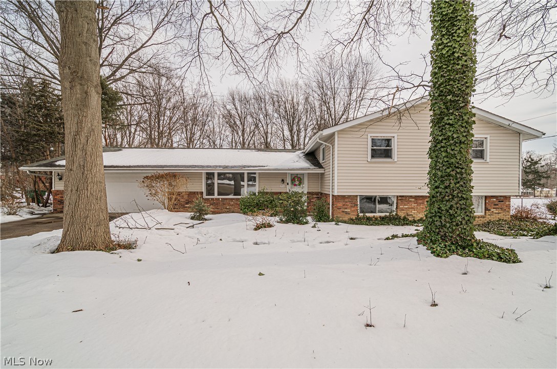 Don't miss out on this immaculate home.  This home is SPACIOUS.  Four bedrooms, three full bathrooms and plenty of room for entertaining inside or outdoors.  Enjoy relaxing in the enclosed sun room with a pedal swing and sky lights, right off of the family room.  An abundance of storage throughout this entire home including the master suite with an oversized walk in closet and attached 2.5 car garage.  Kitchen is open and bright with plenty of cabinets and quartz countertops with more than ample space for all your kitchen and cooking needs.  The second level is graced by beautiful hardwood floors.  The playhouse with shed in the back yard can be an extra cozy spot to enjoy the outdoors.  Large expansive laundry room with a built in the wall ironing board and plenty of cabinets and countertops. You will love the little alcove/mud room that is off the garage leading into the kitchen, so nice for shoes, coats, or anything to keep out of sight.   Come and check this home out for yourself!!