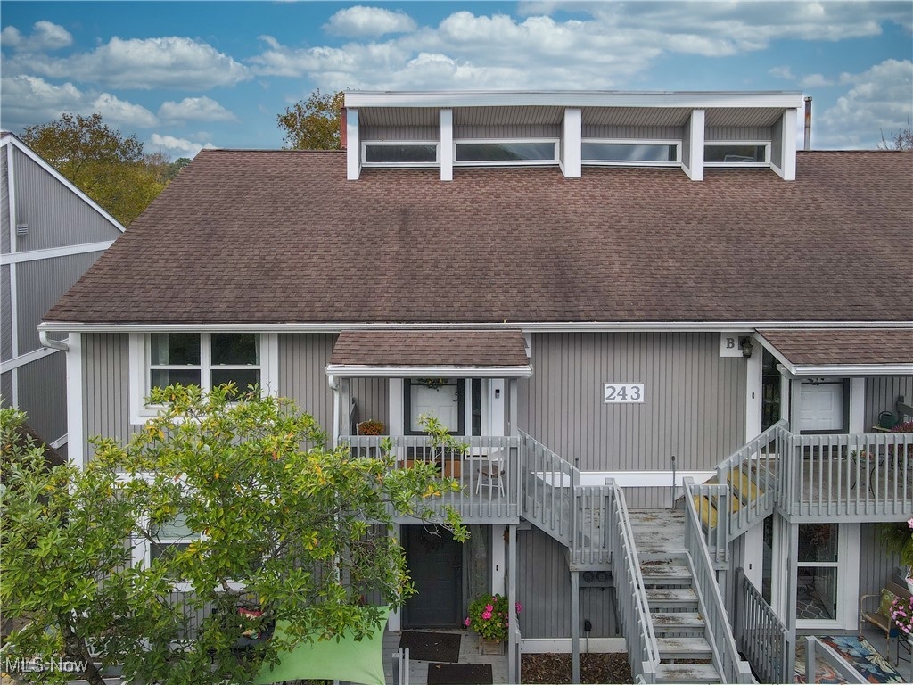 A wonderful move-in ready condo with water views in Snug Harbor.  This lovely 2 bedroom, 2 full bath unit has a large living room with a fireplace and LVT flooring.  A large kitchen has granite counters, and ceramic floors.  The master suite has a large walk-in closet.  There is a laundry room on the main level, and a nice loft area above.  Enjoy the water views from the screen enclosed deck/porch. There is a private garage, multiple common area features, ample parking, and much more.