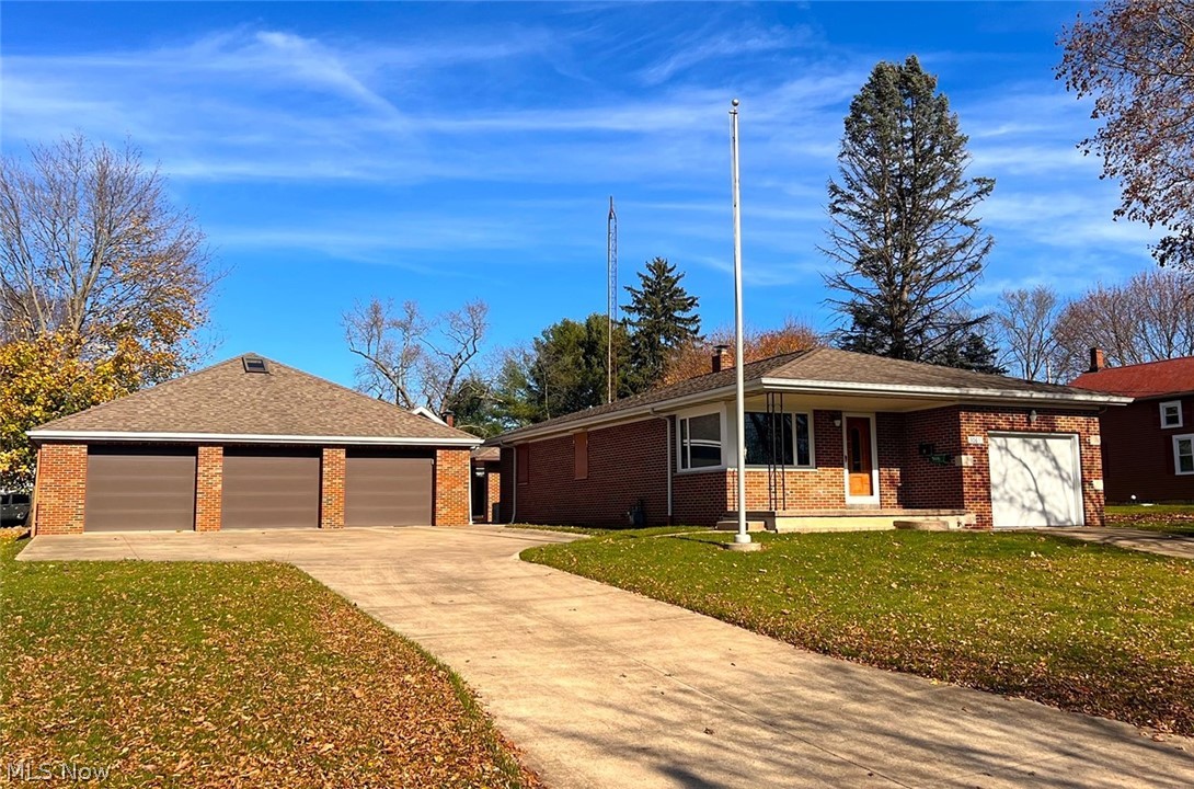 The work has been done! Brick ranch and brick 3 bay shop. The home has an updated modern kitchen with stainless appliances. Living room with corner window, 3 bedrooms including one with a half bath, and a full shower bath all on the main floor. Full basement with utility/laundry room with Insta Hot Water Heater, washer, dryer, built-in safe, and full shower bath. A one-car attached garage. The home has been extremely well built and improved throughout the years of ownership including a Generac whole-house generator, secure window coverings, and updated windows. A must-see! The 37'8" x 35'8" custom-built shop/garage is great for hobby enthusiasts or perfect for a home shop garage. Concrete floors, drains, electric, 3 bay garage doors (2 electric), heated, and overhead attic storage with skylight and back of shop exit for larger items. The shop has its own entrance off the street. A concrete-covered patio area in the backyard. Must see to appreciate all the work.