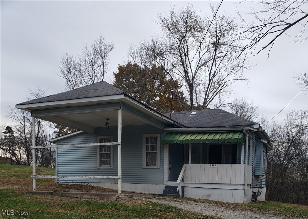 PRICE ADJUSTMENT:   Affordable cottage situated on 1.6 acres which faces Blennerhassett Heights Rd and crosses over Ohio River Rd in the back.  This property offers rare acreage in Parkersburg and is an excellent opportunity for a buyer who wants land, privacy and a chance to add value.  Home features two bedrooms, one bath, a covered front porch with great potential.  With some updates and TLC, this can become a charming full-time home, rental or flip.  Lot has room for an outbuilding, garage, garden and expansion.  Great for investors, contractors or anyone looking for a country feel, yet close to town.  Selling "AS IS".  OWNER SAYS:  LET'S MAKE A DEAL.