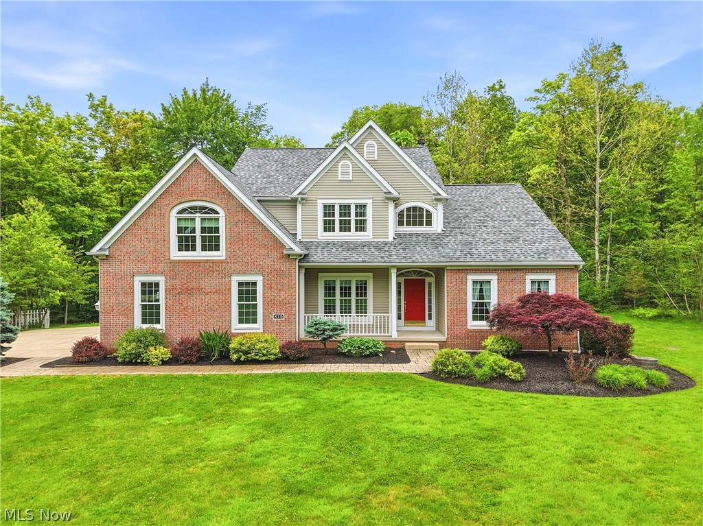 This immaculate colonial home is nestled among the trees on a private 2.5 acre lot! This one owner property is sure to impress with sweeping views, ample entertaining spaces and ideal location! The covered front porch welcomes you into a spacious main level boasting high ceilings and elevated finishes. First floor features a large living room, ample natural light and is anchored with a large gas fireplace and mantle. The remodeled kitchen offers crisp white cabinetry, stone countertops, center island and dining nook complete with automatic blinds for everyday enjoyment. Just off the kitchen is a fabulous screened in porch, perfect for hot summer days and seasonal entertainment! Additionally, You will find a large sunroom to relax and unwind with wall to wall windows and access to the composite deck! The owners suite features an updated bathroom with walk-in shower, soaking tub and dual vanity. Ceramic floors, stone counters and elevated fixtures make this space so inviting. The sizable bedroom and walk-in closet make this a true retreat. A spacious dining room, laundry room and half bath complete the main level.  The second floor landing gives easy access to 2 guest rooms with a walk-in closet and a large guest bathroom. This level is completed with an incredible recreation space complete with skylights, built-ins and HUGE walk-in closet. Make this space into a 4th bedroom by simply adding a door. Exterior finishes include a newly installed composite deck, terraced landscaping, pond with walking trail, fenced in garden and an additional detached 2 car garage! Notable improvements include New Roof(2024), Furnace (2025), Composite Deck, Updated Kitchen and Master Bathroom.