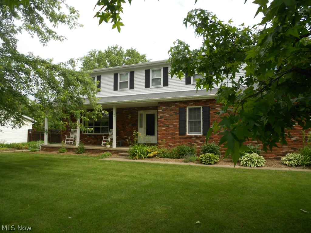 Beautiful four bedroom, two & a half bath colonial in Brook Heights Estates.  Spacious living room leads to dining room & renovated kitchen with stunning maple hardwood flooring.  Kitchen was remodeled in 2010 & features solid cherry cabinets, granite counter tops & stainless steel appliances. Step down to the inviting family room accented by a brick woodburning fireplace.  Sliders open to large screened porch & patio.  Upstairs you'll find a spacious master suite with full bath & walk-in closet plus three additional bedrooms & main bath with double sinks. Furnace, C/A & attic fan new in 2012. New carpet both upstairs & down in 2013.  200 AMP electric service upgrade. Storage barn (12 X 14) with cement floor & loft. Home warranty offered.  Woodridge schools, great location, this is a home you don't want to miss!