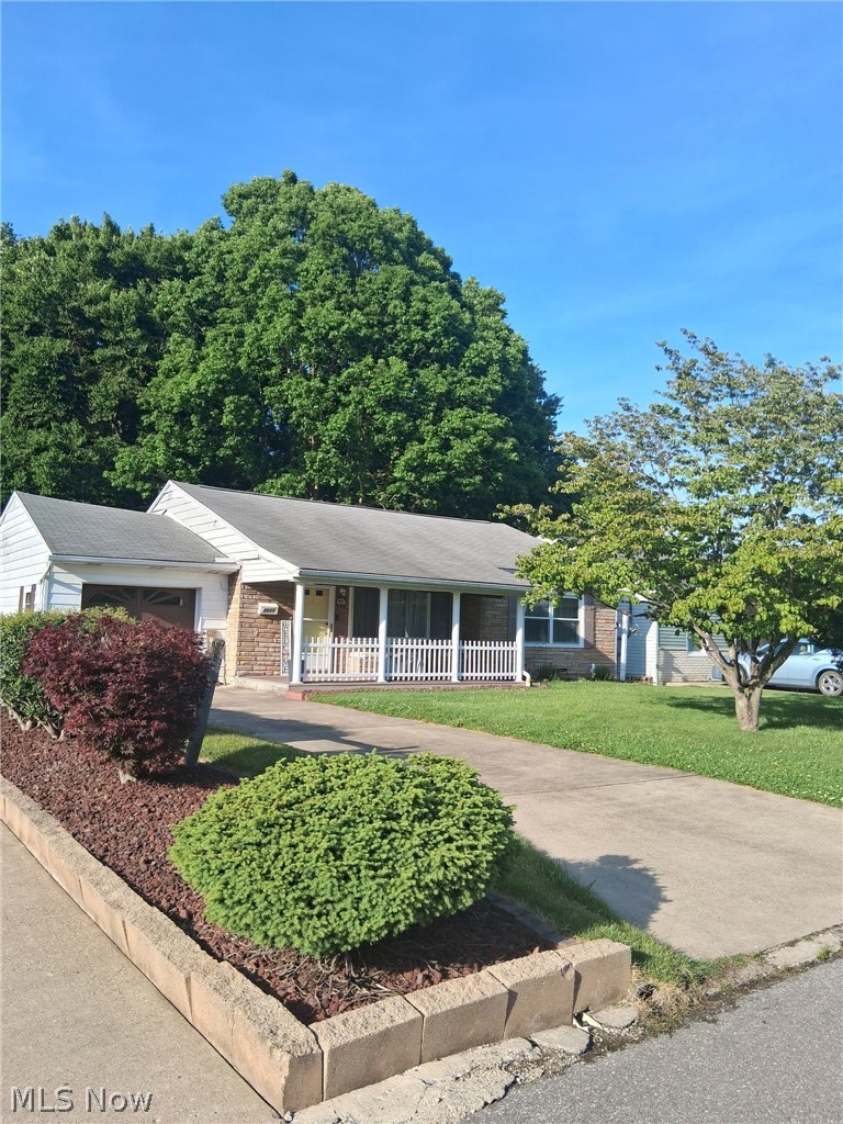 Just over a block to the city park or pool!  That's just one great feature of this charming home . The next great feature is the original wood floors in living room and bedrooms . refinish in original wood color or stain darker to your liking.  No basement worries in this  ranch home,  all one floor plan living perfect for starting out or for downsizing to. Easy maintenance and minimal lawncare .  The living room features a beautiful wood arch leading to hallway and has a fireplace with a gas connection . Living room and bedroom closets are all cedar lined. Front porch with built in bench and back patio behind garage with  fence on both sides. Heating and AC less than  1 year old.  All appliances stay.