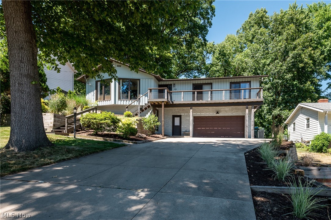 If you are looking for lake living, look no further.  This place will not disappoint as its in mint condition and walking distance to Portage Lakes.  This property includes a dock with an amazing treed backyard, an enclosed porch and multi-tier decks.  Inside has so many upgrades as it has been updated from top to bottom.  This home features an open floor plan, stainless steel appliances in the bright white kitchen and beautiful flooring throughout the home.