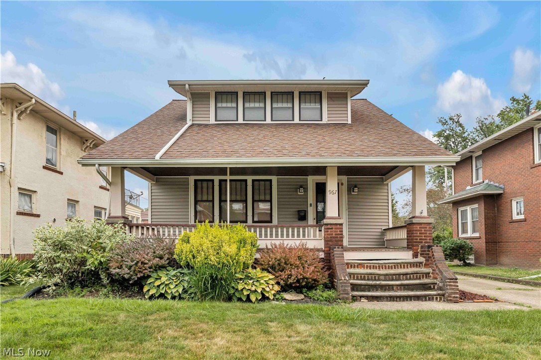 Charming 2-bedroom, 2-bath Craftsman nestled in the desirable Lakeview Park neighborhood! Lovingly maintained, this home is filled with timeless character and craftsmanship that simply can't be replicated. You'll appreciate the inviting covered front porch and outstanding curb appeal. Major updates include a newer roof on the house & garage (2017), furnace (2015) and central air (2016). Step inside to a spacious living room showcasing gorgeous hardwood floors, original woodwork, built-ins, a beveled glass front door and a stunning brick fireplace flanked by built-in cabinetry and abundant windows that flood the space with natural light. The formal dining room is equally impressive, featuring a beautiful chandelier and a charming built-in window seat with storage. The updated eat-in kitchen blends classic style with modern convenience, offering crisp white cabinetry, glass-front display cabinets, sleek black countertops, updated appliances and a cozy breakfast nook. A convenient rear door leads to the deck overlooking the backyard. A beautiful wood staircase leads to two generously sized bedrooms with ample closet space and a full bathroom featuring a tiled tub/shower. The unfinished basement includes the home's mechanicals, an updated laundry area with a washer and dryer, a convenient second full bathroom, and ample room for storage. Outside, enjoy a paved driveway leading to a detached one-car garage and a generously sized backyard with endless possibilities for entertaining, gardening, or relaxing. The location is truly exceptional! Just minutes from downtown Lorain's restaurants, shopping, and entertainment, and within walking distance to Lakeview Park & Lakeview Beach, where you'll enjoy the beach, historic Rose Garden, Sunset Café, Sunset Terrace, playground, kayak, canoe and paddleboard rentals, beach volleyball, lawn bowling, reservable areas and breathtaking Lake Erie sunsets. Don't miss this rare opportunity. Call and schedule your showing today!