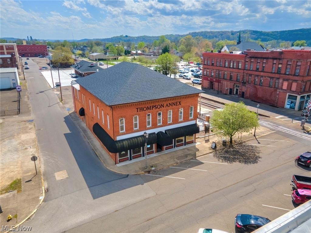 Remarkable Business Opportunity! Whether you are an Investor or a seasoned Restauranteur, this opportunity may just be exactly what you are looking for. Thompson Ninety Nine Restaurant (with an additional income producing 7 Executive Upstairs Offices) located in the heart of Historic Downtown Coshocton is now available for new owners. Updates across the whole property are details that are sure to impress, including but not limited to--the restaurant's custom build 30 ft. 14 seat high-top bar, 49 seat outdoor patio with natural gas fireplace-- to the upgraded LED lighting, carpet and paint in the upper level. This remarkable property boasts a large off-street parking lot with 30+ spaces. All of the restaurant & office furniture and equipment to convey to the new owners at a successful closing. The upstairs offices can be leased or rented and are fully furnished. Contact a licensed real estate agent for a private showing.