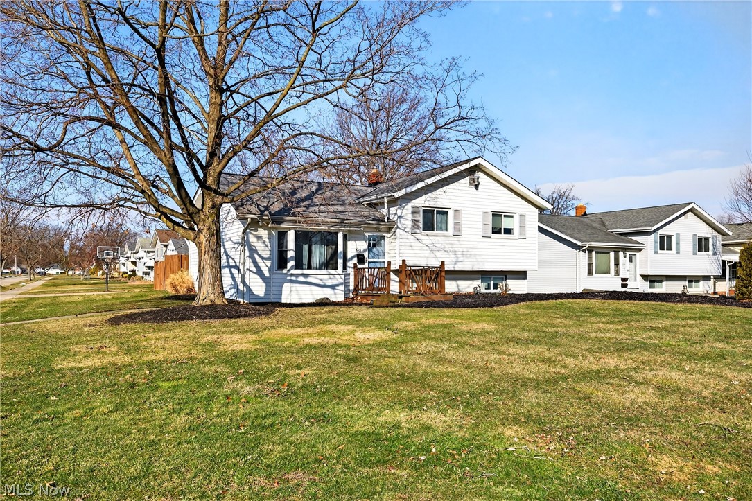 Experience the perfect blend of spacious design in this stunning 4-level split-level home featuring 4 bedrooms, 2 full baths, and a beautifully finished basement. Ideal for growing families or those who love defined living spaces. Enter into an open, airy vaulted living room that impresses with elegant woodwork, a cozy corner fireplace, and decorative columns that add timeless sophistication. The vaulted eat-in kitchen is a true highlight, boasting expansive granite countertops, gorgeous cabinetry, perfect for everyday meals or hosting gatherings. Additional conveniences include a dedicated laundry room, a versatile office space, ample storage in the lower basement level, and a practical 2-car  garage. Outside, enjoy a nicely landscaped corner lot with a fully fenced yard. Great for pets, play, or peaceful relaxation in your private outdoor oasis.