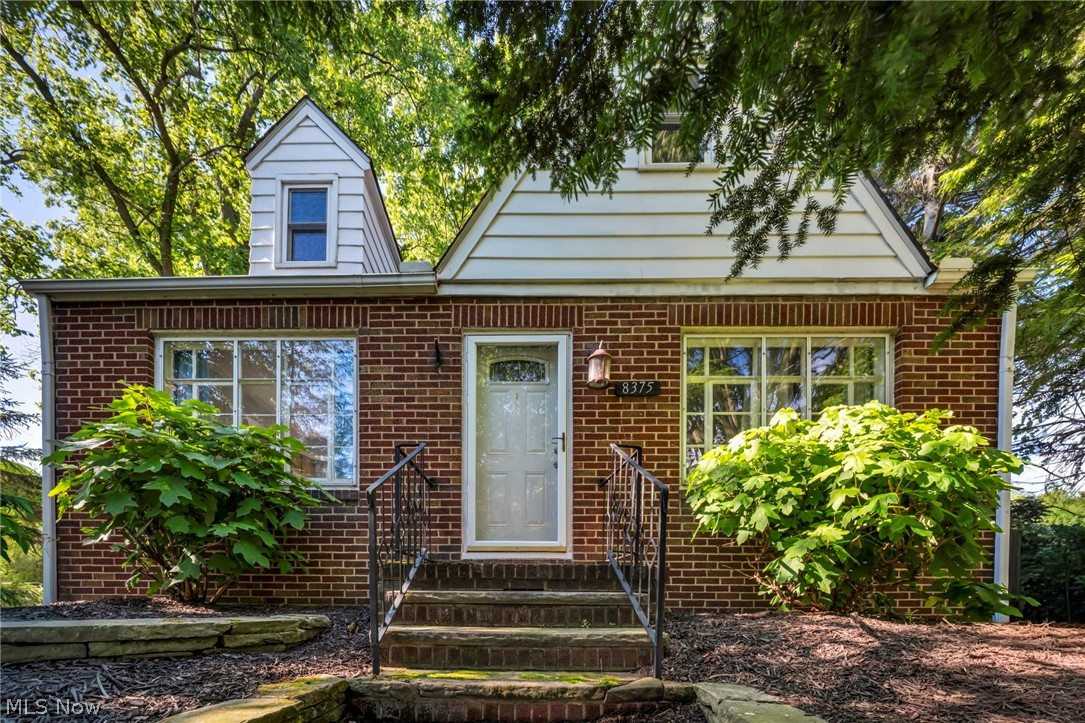 Welcome home to this charming all-brick home perfectly situated in the heart of Mentor! Nestled on a rare and  nearly half-acre lot shaded by beautiful mature trees, this property offers the perfect blend of space, convenience, and potential. A true showstopper is the 3 car garage space! Inside, you'll be greeted by a nice sized living room with a warm fireplace. The bright eat-in kitchen offers lots of oak cabinet space and a comfortable layout! Two bedrooms are conveniently located on the first floor with a remodeled full bathroom. Upstairs, is the master retreat with a huge bedroom, walk-in closet and bonus area. The expansive basement provides endless possibilities with a large recreation area and separate storage space and laundry room. Car enthusiasts, hobbyists, or anyone needing extra storage will love the oversized 2.5-car garage plus an additional detached 1-car garage. Additional updates include a newer HVAC (2017). Ideally located just minutes from shopping, restaurants, parks, I-90, and Route 2, this home offers the convenience you've been looking for with the yard and privacy you've always wanted. Don't miss this incredible opportunity!