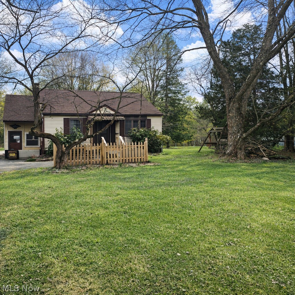 Just Reduced!  2 Bedroom Ranch on 2.23 Acres, Weathersfield Schools!  Hardwood floors with large living room, 2 nice size bedrooms, eat in kitchen. Home has a newer roof, newer forced air gas furnace.  Additional large entry room used as office. Large 2 car garage used as workshop.  Additional 48' x 24' pole building.  Exceptional piece of land with old growth trees and creek which is great for recreation and maybe future building site. Contents being sold by online auction.  Sale by order of Executor.