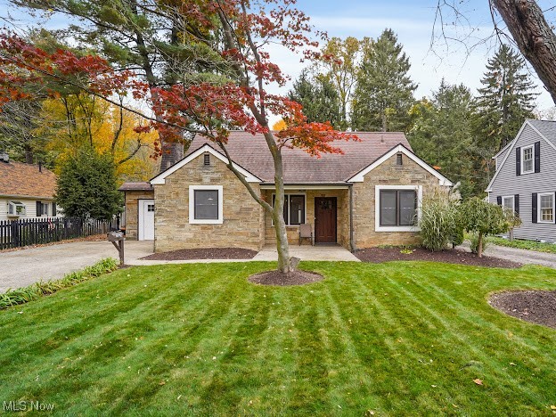 Convenient prime West Akron location. Adorable garden cottage style home exudes with charm. The open floor plan offers ease when entertaining or simply relaxing at home. Many original features throughout the home such as hand-hewn accent beams, 2 exquisite exterior doors and 2 working fireplaces. Newer renovations along with modern farmhouse design blends the character of old and new. The kitchen opens to the living area, boasts white cabinetry, white apron/farmhouse style sink, gorgeous medium express stained butcher block countertops, stainless steel appliances and newer light fixtures.  The brick wood burning fireplace w/wood hewn mantel, pantry with barn style sliding door and bar height wooden table adds to the character of the vintage style of years gone by. Cedar plank ceilings span both in the kitchen and dining room. There is a whitewashed stone fireplace in the living room. Located off the living room is a sunroom that overlooks the private backyard surrounded by a vinyl privacy fence. Both bathrooms have been completely updated--one bathroom between both bedrooms, has a tiled shower/tub combo, ceramic tile flooring, updated vanity and updated light fixture. The other full bathroom on the main level boasts a large walk-in shower that has a waterfall shower panel with body spray. Laminate wood flooring in the kitchen, living room, hallway and 2 bedrooms on the first floor were recently installed.  Bedrooms 3 & 4 are on the 2nd level. Replacement windows. The interior of the home has been recently painted. The hot water heater was replaced in 2023. Included with the sale at no value is a SS 3 door refrigerator, SS gas convection oven, SS 3 compartment sink, SS handsfree sink, SS 8 ft prep table and LVT flooring. The home is conveniently located near shopping and restaurants. Easy access to major highways and downtown Akron. Don't miss out! Come see this gem today!