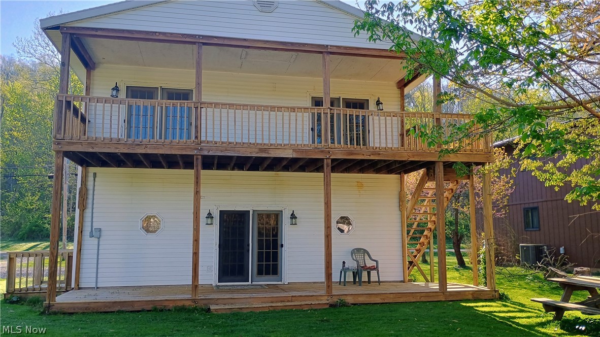 Riverfront living year round. Nice view of the Muskingum river from two decks that are the full width of the house. The basement is ground level and features a full bath and family room. On the second floor you will find a large living room with French doors to the covered wood deck. The living room flows into the dining area and kitchen. The kitchen has all new appliances, counter tops, flooring and lighting. The new flooring and lighting are carried through the whole house. There is another set of French doors in the dining area leading out to the large deck. The home has new paint, flooring, some new plumbing, and new commodes. The over size two car garage has an electric door opener. This residence is ready to move in and enjoy the view.