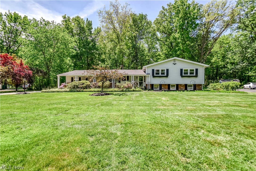 Welcome to 9412 Beaver Creek Dr — a beautifully maintained split-level home tucked away on one of Mentor’s most desirable cul-de-sac streets. Situated on nearly an acre with no through traffic, this property offers a rare combination of privacy, serenity, and convenience. Surrounded by mature trees and backing to a peaceful wooded setting, the backyard feels like a private retreat — perfect for relaxing evenings, entertaining, or simply enjoying nature from home. Despite the tranquil setting, the location provides quick and easy freeway access along with close proximity to shopping, dining, parks, and top local amenities. Inside, the thoughtfully designed split-level layout offers comfortable and functional living spaces with room to spread out for everyday living and entertaining alike. Pride of ownership is evident throughout the home, which has been meticulously cared for over the years. The home also features several valuable updates, including newer windows installed in 2020 and 2025, along with kitchen appliances that are only 2–3 years old. A heated garage provides ideal year-round comfort for parking, storage, hobbies, or workshop space. The hot tub was operational when last used a few years ago and offers additional potential for relaxation and entertaining. Opportunities like this are rare in Mentor — a quiet cul-de-sac setting, nearly an acre of land, wooded privacy, thoughtful updates, and unbeatable convenience all in one exceptional property.