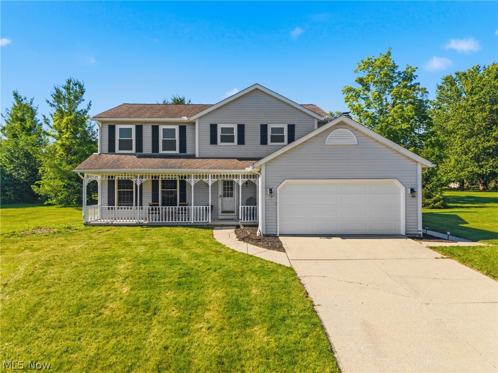 Welcome to 3440 Burrwood Drive, a beautifully updated 4-bedroom, 2.5-bath colonial in the desirable Richfield Hills neighborhood within the highly acclaimed Revere School District. Situated on nearly half an acre, this move-in-ready home offers over 2,100 square feet of living space, thoughtful updates throughout, and exceptional curb appeal.

An inviting covered front porch welcomes you inside, where fresh paint and brand-new windows create a bright, modern feel while providing energy efficiency and abundant natural light. The spacious living room flows into the formal dining room, creating an ideal setting for gatherings and everyday living.

The kitchen has been refreshed with brand-new countertops and three new appliances, offering both style and functionality. Just off the kitchen, the family room features a cozy fireplace and opens directly to the brand-new deck overlooking the large backyard—perfect for entertaining, gardening, or relaxing outdoors. A convenient first-floor laundry room and half bath complete the main level.

Upstairs, you'll find four generously sized bedrooms, including an owner's suite with an updated en-suite bath featuring a new shower and vanity. The full basement offers abundant storage and potential for future living space, a home gym, or recreation area. Additional highlights include a freshly painted garage floor and attached two-car garage.

Ideally located just minutes from Cuyahoga Valley National Park and the Cuyahoga Valley Scenic Railroad, residents enjoy easy access to hiking, biking, and year-round outdoor recreation. Richfield's small-town charm, local parks, community events, and convenient access to I-77, I-271, and the Ohio Turnpike make this an exceptional place to call home.

Combining space, comfort, modern updates, and a prime location, this beautifully maintained home is one you won't want to miss. Schedule your private showing today. APHW Home Warranty Included!