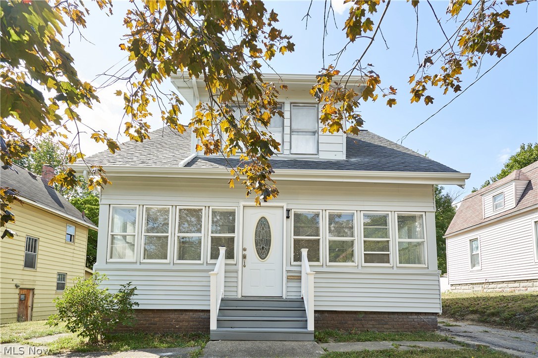 Welcome to this beautifully rehabbed colonial where modern upgrades meet classic charm! Start your mornings in the sun-drenched 3-season room, surrounded by walls of windows. The interior impresses with fresh neutral paint and brand-new flooring throughout the spacious living and dining areas. Prepare to be wowed by the massive kitchen, featuring stunning, floor-to-ceiling Carrara-style marbled tile, a sleek stainless steel hood, custom cabinetry, and an oversized pantry. Upstairs offers three generously sized bedrooms with ample closet space and a fully renovated bathroom. Peace of mind comes standard with a roof and electrical updated in 2018, plus a furnace, A/C, and hot water tank all replaced circa 2022. The exterior boasts fresh paint, newer windows, a large deck for entertaining, and a private, fenced-in backyard. Schedule your showing today!