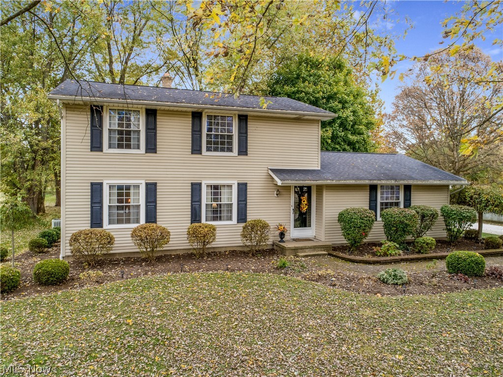 Welcome to this 4 bedroom colonial home in the Tuslaw School District. You are greeted by the professionally landscaped lot of almost half an acre. The home offers a large great room and open dining room and kitchen. The kitchen has newer cabinets and counter top and new flooring in the dining room and kitchen. There is a private bonus room that makes a great office or could be converted to a first floor laundry room. Finally a half bath completes the first floor. The upstairs provides four bedrooms and full bath. Hardwood floors are under the carpet in 2 bedrooms and the great room. The full bath has been recently renovated with new counter top, cabinets and flooring. Replacement windows are throughout the home. Home owner offering a one year home warranty. With a full basement and 2 car attached garage, you can't wait to call this home.