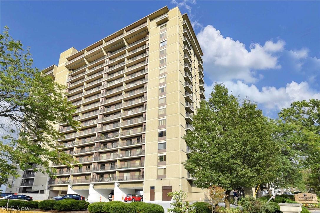 #1202 - Stunning remodel of this 1370 s.f. light-filled two bedroom two bath southwest corner in wonderful Waterford originally built as a condominium! Experience colorful sunset and Lake Erie views from your two balconies; one in the living room and one in the primary bedroom. Beautifully designed open floor plan with expansive room sizes. Espresso stained wood flooring throughout the suite with exception of bathrooms equipped with tile flooring. The open kitchen features modern cabinetry, granite counters, chic tiled backsplash, and stainless steel appliances along with a breakfast bar. Both bathrooms have been updated with beautiful cabinetry, fixtures, and lighting. Convenient in suite laundry (purchased 2026) located in a closet next to the hall bathroom. In addition, you control when you want heat/air with your own HVAC. (Replaced 2025). One underground heated garage space is included, along with a storage lockers (one small and one large) located on each floor. All utilities included except internet and cable. Amenities include the newly redesigned Great Hall on the entry level of the building so convenient for entertaining; also a dog run, and a newer observation deck overlooking Lake Erie. Additional amenities on the lower levels are an indoor pool (currently under construction) with adjacent hot tub, fitness center, sauna, billiards/party room, wine cellar, car wash. The Waterford is located in one of Lakewood's most desirable lakefront communities, just minutes to Edgewater Park, downtown Cleveland, and the best shopping and dining in the area. Schedule your private tour today!