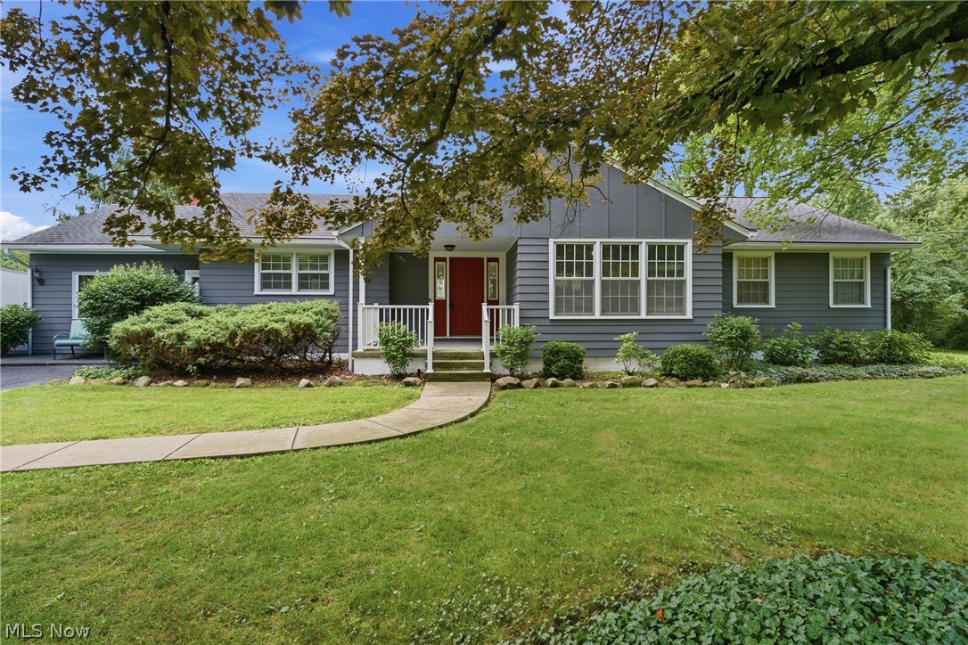 Escape to the tranquility of country living at 26737 Akins Road. This well-maintained ranch is nestled on 1.44 acres in Columbia Station. The spacious living and dining area features a cozy fireplace and large windows overlooking the beautiful backyard. The kitchen offers quality custom cabinetry, includes all appliances, and opens to a generous family room with access to the sunroom. The home features three bedrooms, including a primary suite with a walk-in closet and private ensuite bathroom, plus an additional full bathroom for the secondary bedrooms to share.
The expansive lower level offers a recreation room, second kitchen, and abundant storage or workshop space. Recent updates provide peace of mind, including a new septic system (2025), new fencing, fresh interior paint, new carpet, and refreshed exterior paint. This beautiful property offers the perfect blend of privacy, space, and comfort while remaining conveniently located near everyday amenities.