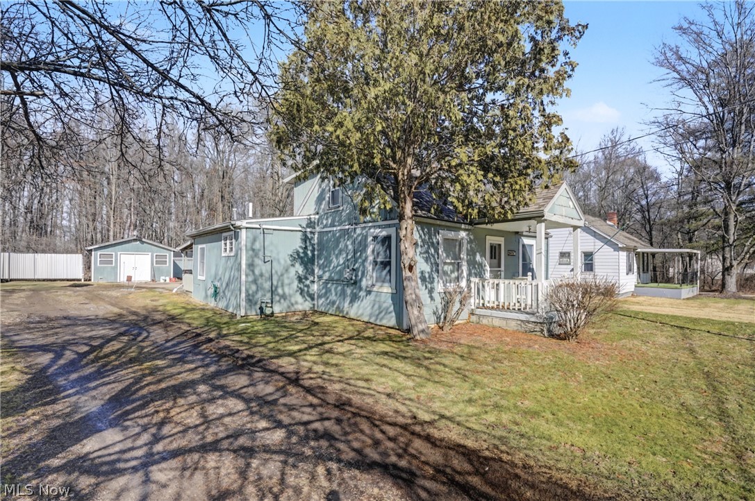Absolutely charming 3-bedroom, 2 full bath Cape Cod offering versatile living space and exceptional garage amenities - perfect for your own business! The cozy kitchen features abundant cabinetry and flows seamlessly into a spacious rear family room—perfect for relaxing or entertaining. A welcoming front living room adds additional gathering space.  This property offers 3 lots with 2 apple trees, 2 peach trees, & 1 pear tree.

The first-floor primary bedroom offers convenience and privacy, complete with easy access to a full bath. A second full bath and first-floor laundry provide everyday functionality. Upstairs, you’ll find two additional bedrooms.

Car enthusiasts, hobbyists, or business owners will love the three garage spaces, including two dedicated office areas and a separate shed for added storage. The heated garage makes this property functional year-round with lift.

New Roof - 2022.