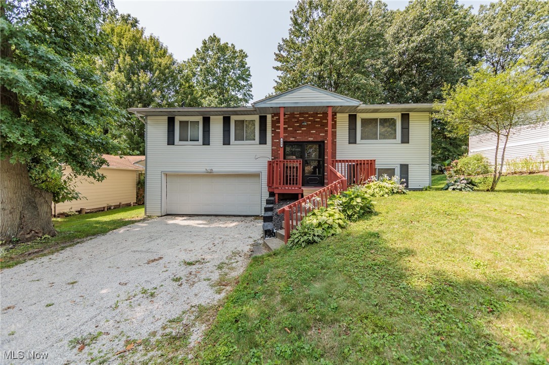 This charming split-level home offers a perfect blend of comfort and style, featuring 3 spacious bedrooms and 1.5 bathrooms. As you enter, you're greeted by a bright and open living area, with large windows that let in plenty of natural light. The main level boasts a cozy living room, a dining area, and a modern kitchen with updated appliances and ample counter space. Upstairs, you'll find three generously sized bedrooms, each with ample closet space, and a full bathroom. The lower level of the home provides additional living space, perfect for a family room, home office, or play area. Outside, the property includes a fenced in back yard, and an attached garage for added convenience. Newer furnace and A/C, Gutters, and downspouts.