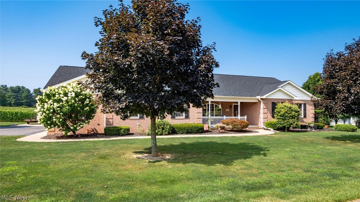 Custom-built quality meets peaceful country living! This exceptional home showcases stunning Amish-crafted woodwork and custom finishes throughout. Offering a heated 3-car attached garage, beautiful custom tile work, and a thoughtfully designed floor plan, this home has space for everyone. The finished lower level features a second kitchen, an expansive family room, and two optional bedrooms—ideal for guests, multi-generational living, or entertaining. You'll also appreciate the incredible storage offered by the 14-block basement.
Recent updates include a newer roof, furnace, and central air for added peace of mind. Relax year-round in the inviting four-season room while taking in the picturesque country views. Outside, you'll find beautiful landscaping, a large paved parking area, and a scenic setting that's just minutes from Jaycees Golf Course with convenient access to I-70. This is a rare opportunity to own a meticulously maintained, custom-built home that perfectly blends quality craftsmanship, comfort, and location.