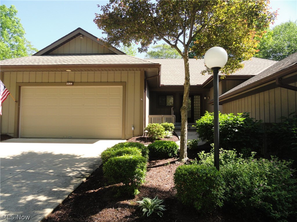 Spectacular ranch condo situated in "The Crossings," a highly desirable community nestled on the edge of the Cuyahoga Valley National Park. The unique floor plan is light and bright and open with vaulted ceilings and skylights plus windows and sliders across the back allowing plenty of natural light. Foyer entry with beautiful wood floors that continue into the kitchen and dining room. The great room has soaring ceilings and a beautiful stone fireplace from floor to ceiling and connects to the dining room / kitchen with sliders to the private wrap around deck porch offering breath taking views of the wooded ravine year round. Meticulously maintained by these original owners plus all mechanicals are replaced within 5 years. The  community includes a pool and is close to Portage Crossings for groceries, movies and restaurants. Won't last!
