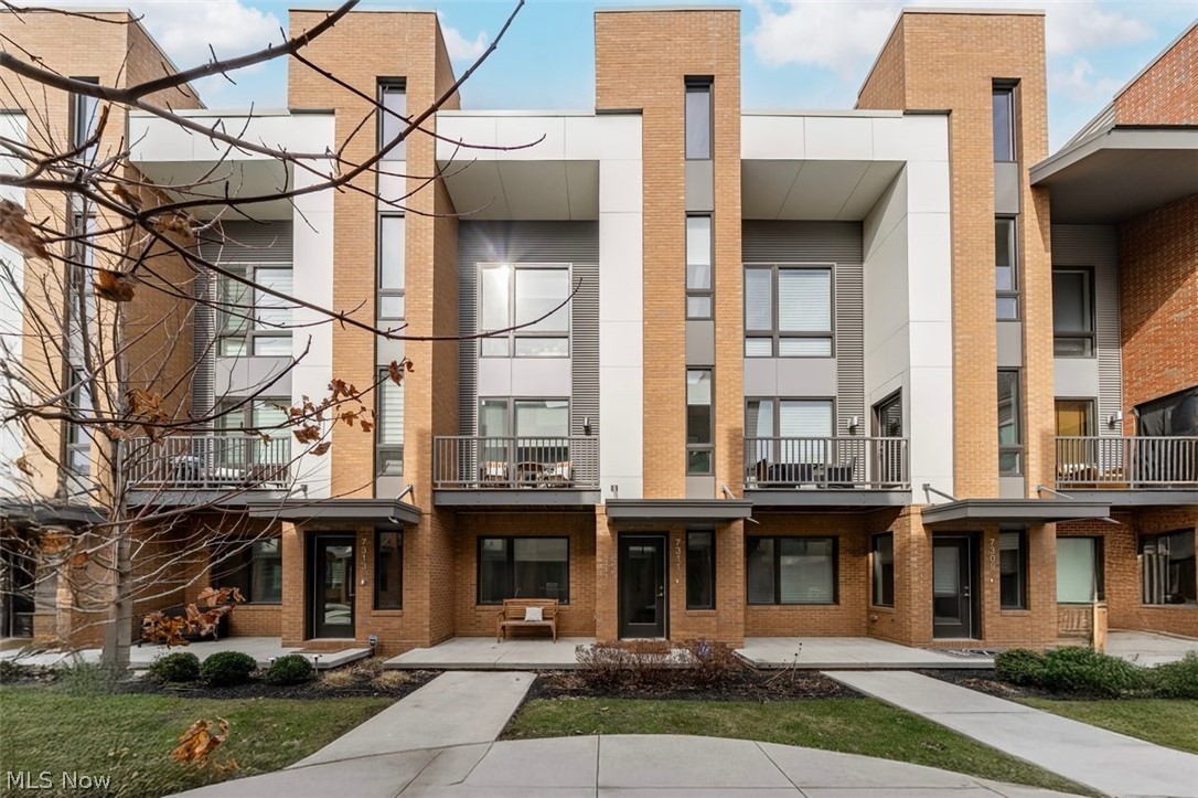 Welcome to refined city living in the heart of Battery Park Place! This stunning luxury townhome at 7311 Catlin Ct offers the perfect blend of modern design, thoughtful upgrades, and breathtaking views, all in one of Cleveland's most sought-after lakefront communities; plus the benefit of a 15year tax abatement with approximately 11 years remaining. This beautifully appointed 2 bedroom, 2.5-bath residence features an open, light-filled layout with high-end finishes throughout. The chef's kitchen is a true showpiece, complete with quartz countertops, premium GE Café appliances, sleek cabinetry, an oversized bar ideal for entertaining, and a large walk-in pantry offering exceptional storage. The home is further enhanced with a reverse osmosis water filtration system, delivering clean, high-quality drinking water right from the tap. The first-floor office/flex space adds incredible versatility with a custom built-in Murphy bed, perfect for guests or a stylish work-from-home setup. Upstairs, the master suite is a private retreat featuring a spacious walk-in closet and a spa-inspired ensuite bath with a double vanity and a stunning waterfall walk-in shower. Wake up to beautiful Cleveland skyline views right from your bedroom. One of the home's most impressive features is the rooftop terrace offering unbelievable panoramic lake and city views, creating the ultimate space for entertaining or relaxing above it all. Additional highlights include a 2-car attached garage with finished upgraded floortex concrete floors and an upgraded furnace system with an integrated UV light for enhanced air quality. This prime location boasts a walkable lifestyle just moments from Edgewater, Downtown Cleveland, the Towpath Trail, and the lively Detroit Shoreway and Gordon Square Arts Districts. Battery Park also offers desirable community amenities, including a dog park, a popular on-site brewery, and Good Company. Luxury, views, tax savings, and high-end upgrades, this one truly has it all!