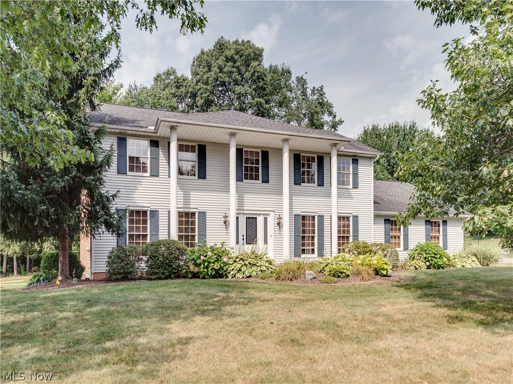 Location Location! Beautifully updated 4 bedroom/3.5 bath colonial, approx. 3168SF including finished lower level, 3 car side load garage & conveniently located in City of Green* Foyer entry with wood floor, crown & new beveled glass door & side lights* Great room with brick gas log fireplace opens to living room/den* Formal dining with crown & chair molding* Updated eat in kitchen with granite counter tops, tile back splash,  new stainless refrig, dishwasher & microwave (6 mos. old) & Jenn air range, island & pantry* Dining area with slider to oversized deck* 1st floor laundry with tub* Updated half bath completes the 1st lfoor* 2nd level with spacious master bedroom w/walk in closet with built ins*. Updated master bath with his & hers vanity, granite, heated tile floor, tile shower & jetted tub, 3 additional bedrooms & guest bath* Lower level with full bath,  family/media room includes projector, surround sound--speakers & equipment, built in storage bench, wet bar with refrig, wine
