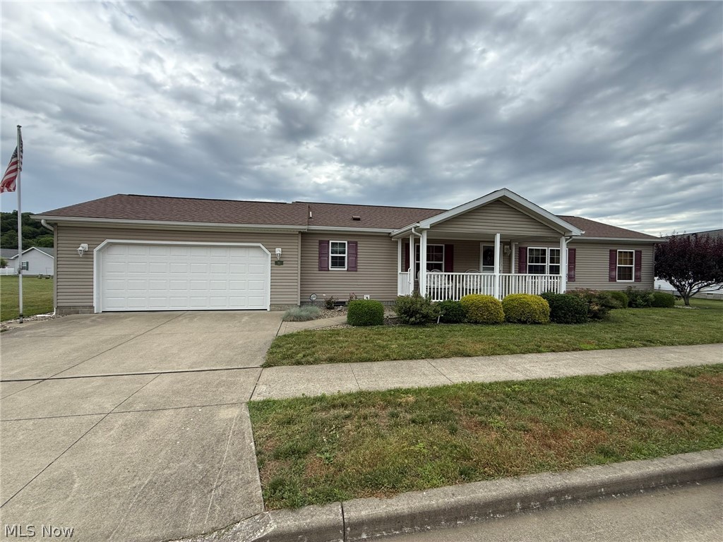 Convenient, 1 story living in this well maintained home.  Handicap accessible features with 36" doorways.  3 bedrooms, 2 full baths with crown molding throughout.  Abundant cabinet space in the kitchen which opens to the charming breakfast nook.  Main floor laundry features built in cabinets and utility sink.  Walk in closet in the master bedroom with walk in shower.  10 X 8 stamped concrete patio.  2 car attached garage with new overhead door in 2025.  Lot rent of $455 per month includes lawn mowing, snow removal, community center and more.  55 and over community.  Taxes reflect the seller receiving a homestead credit of $391.60 for 2026.