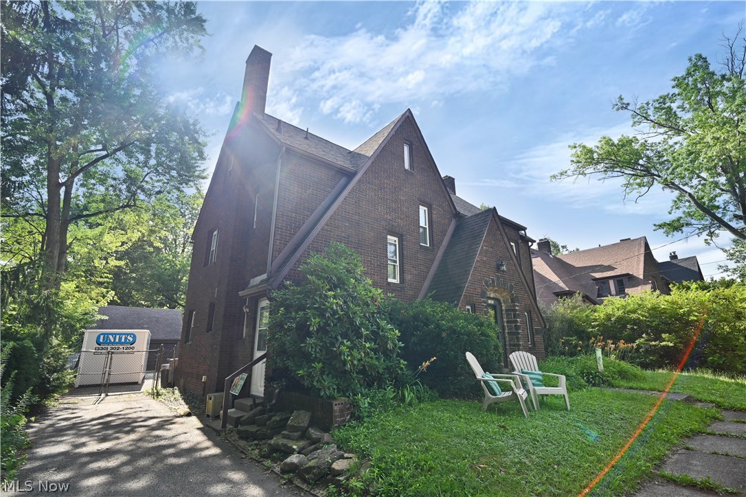 Experience the perfect blend of timeless character and modern comfort in this beautifully maintained 5-bedroom, 3 full and 1 half bath brick Tudor offering over 2,800 square feet of living space. Nestled in a neighborhood rich with historic charm and just minutes from Youngstown State University, this stately home showcases the craftsmanship and architectural details that make Tudor homes so highly sought after.

From the moment you step inside, you'll appreciate the warm, inviting atmosphere created by gorgeous hardwood floors that flow throughout the home, spacious rooms, and abundant natural light. The oversized living room provides an ideal gathering space, while the formal dining room is perfect for hosting holidays and special occasions. The first-floor office offers excellent flexibility and can easily serve as a home office, library, playroom, or additional living space to fit your needs.

The home features five generously sized bedrooms and three full baths plus a convenient half bath, providing plenty of room for family, guests, or multi-generational living. Lovingly cared for through the years, this home has been thoughtfully maintained while preserving its classic charm and character.

Outside, enjoy a fully fenced backyard with plenty of space for entertaining, gardening, pets, or play. A detached two-car garage offers additional storage and convenience.

If you've been searching for a home that combines historic elegance, generous living space, and an unbeatable location near Youngstown State University, this exceptional Tudor is one you won't want to miss. Schedule your private showing today and experience everything this remarkable property has to offer.