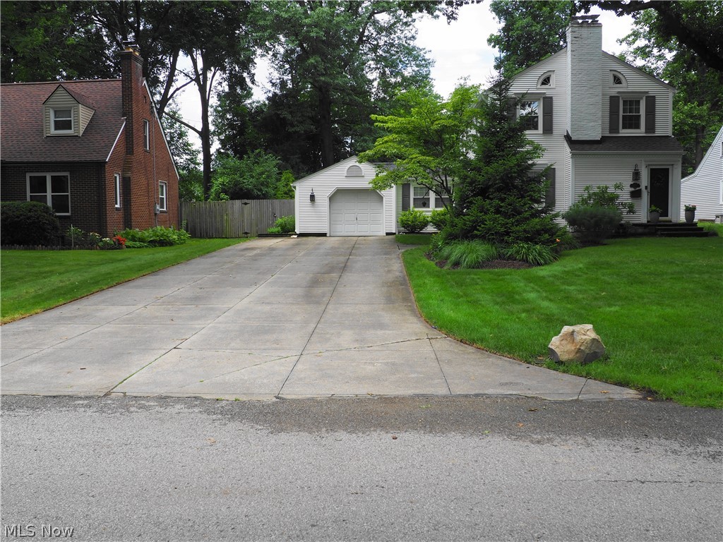 Lot: 75 X 154   Beautifully maintained 3 bderoom 1 1/2 bath colonial on a large fenced lot that boasts of a fantastic custom 26 X 24  patio great for entertaining or just relaxing. The kitchen is updated with granite counters, a pantry and appliances. The formal dining room has French doors leading to a first floor family room with crown molding and a trayed ceiling plus the half bath. The roomy living room has a gas fireplace.  An attached  garage into a breezeway that's ready for that morning cup of coffee. There's a basement recreation room that has a pool table that will stay if the buyer wants plus a wood burning fireplace.  The basement has been waterproofed and has a transferable warranty. Roof and gutters were done in 2020. A home warranty is also included.