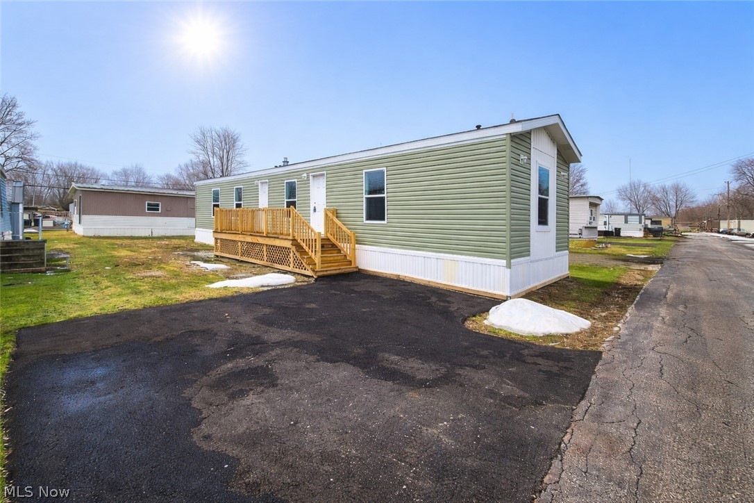 Welcome to this brand new construction home looking for its new owner! Equipped with 3 bedrooms and 2 full bathrooms you will also get to enjoy a fully paved 2 car driveway, expansive 6x20 side deck for relaxing outside. With 1,056 sq ft in living space you will certainly appreciate the space this home offers. Stretch out in the large living room which divides your primary bedroom from the two guest bedrooms and shared full bathroom. The kitchen offers not only all new light and bright cabinetry, but a buffet of additional cabinets with additional counter space perfect for entertaining. All kitchen appliances are included for you to pack your bags and move right in! Refrigerator, stove, dishwasher & microwave. The dedicated laundry room is tucked away right off of the dining area and the secondary exit also leading you to the outside deck. The primary bedroom is not only spacious to begin with but also offers a walk in closet for plenty of storage space. Schedule your private viewing with your favorite realtor to see if this is the home you have been waiting for!