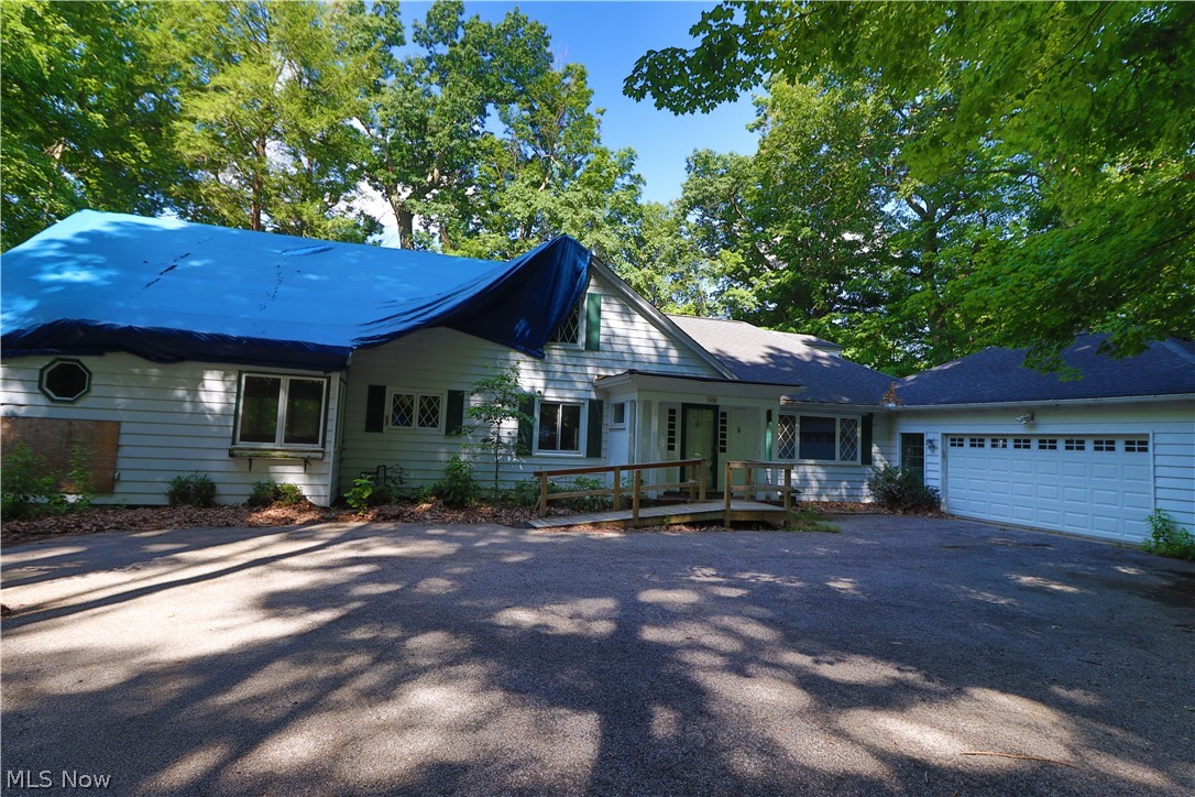 Calling all contractors, investors, and visionary buyers! A rare opportunity awaits at 40 Wintergreen Hill. Nestled on a beautifully secluded, 1.4-acre wooded lot, this property offers incredible privacy and a tranquil, nature-filled setting in an enviable location. The existing home is a true rehabber’s special—recently impacted by a fallen tree and in need of extensive repairs and updates. When you choose to undertake a major renovation project to restore and modernize the home, the potential equity here is undeniable. Properties boasting this level of privacy, mature trees, and land size in such a desirable neighborhood do not come along often. Bring your contractor, your toolkit, and your imagination to turn this diamond in the rough into something extraordinary. Cash or specialized financing preferred due to property condition. Schedule your private walk of the site and explore the possibilities today!