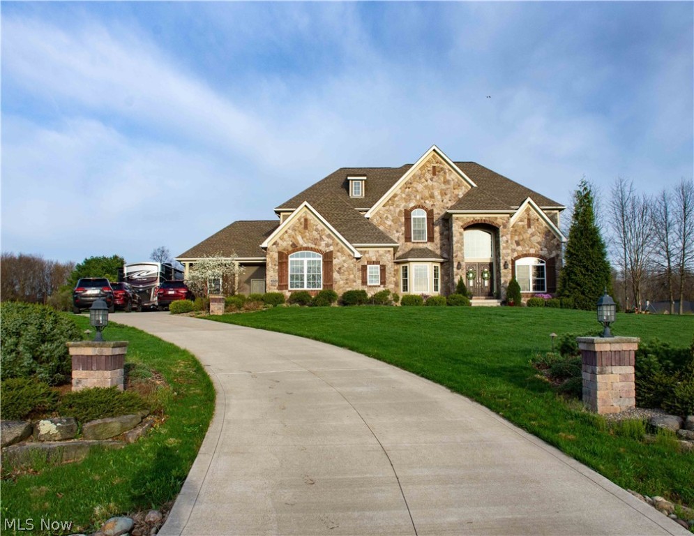 5 BR  5 Ba Bath Township home located on a nearly 4 acre park-like lot in Royal Meadows subdivision. Spend your summer enjoying the inground pool surrounded with stamped concrete and nice landscaping.  This home features a very open floor plan including large kitchen with custom cabinetry, granite countertops, built in appliances,  and a walk-in pantry. The kitchen is open to the 2 story great room featuring a 19 ft stone fireplace framed by angled picture windows and vaulted ceilings to take advantage of the natural light. Expansive  master br includes large walk-in closet and bath with custom tile shower and jacuzzi tub as well as separate vanities. There is one BR on the first floor with full bath currently used as an office. The basement includes 900 square feet of finished space including a family room, exercise room, and an additional room with egress window that could be 6th BR. Heating system includes zoned heating and cooling as well as AprilAire humidifier. 400 amp electrical service. 4 car garage with stairway access to basement. Outside you will find 2 stamped patios, one with gas firepit. At the rear of the lot there is a pistol range with engineered backstop for safety which also adds to your privacy. Come enjoy your summer!!