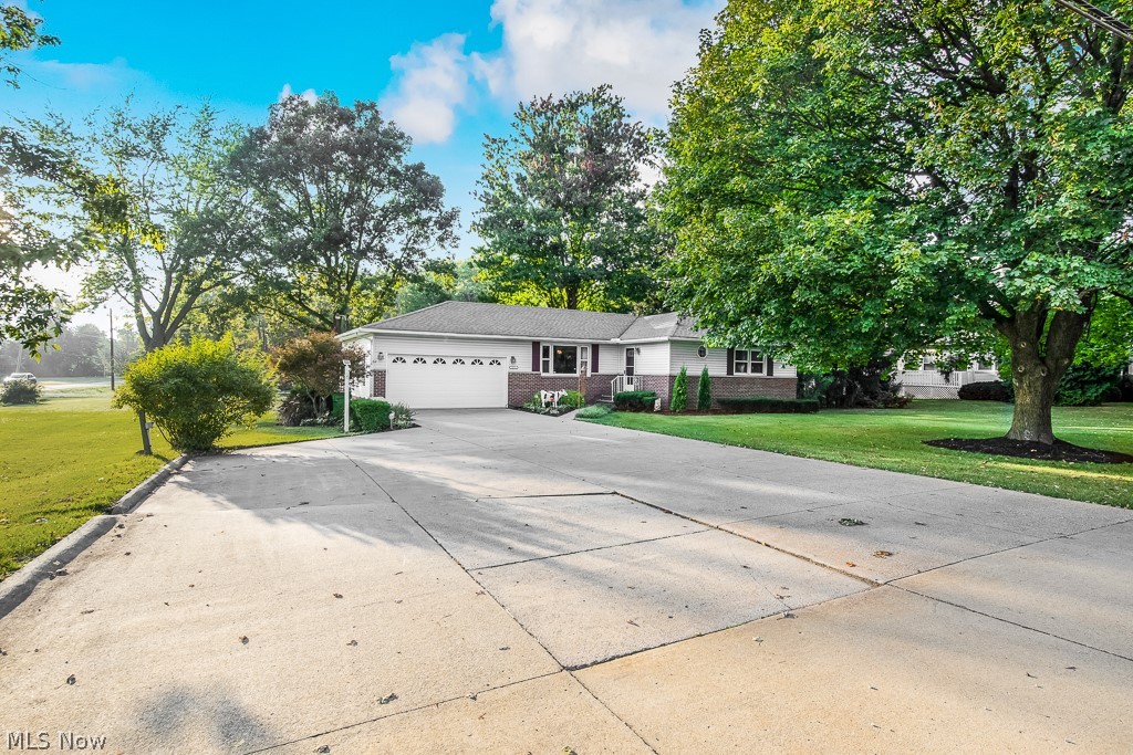 Welcome to this amazing ranch on almost an acre corner lot! It has Newer Kitchen Appliances, great hardwood floors and very clean throughout. This home has only had 2 owners, it has 3 bedrooms and 2 baths with 2 car attached garage. Freshly painted and newer carpet in the living and bedrooms and new door hardware throughout, Finished basement w/ ample storage, There is a enclosed patio and a covered patio attached to the house and a New Pole barn 30x40 with a covered patio/ lean-to w/electric and a 220 hook-up. Oversized Driveway, and private access to the Barn. This house has a separate water well plumbed for free lawn and gardening use. Schedule your showings today, this wont last! **Highest and and Best By Sunday at 4pm***
