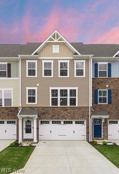 This nearly new Avon townhome checks every box for easy, stylish, low maintenance living, and it is truly move in ready from day one. Pull into the attached two car garage and step right into a finished walkout lower level ready to become a rec room, media space, home gym, or hobby area, whatever fits your life right now or down the road. This flexible bonus space is one of the features that sets this townhome apart from many others in the community. Head up to the main level and you will find beautiful luxury vinyl plank flooring flowing throughout an open concept kitchen and living space designed to impress guests and simplify everyday living. The kitchen brings high end cabinetry, granite countertops, an upgraded herringbone style backsplash, stainless steel appliances, and lighting fixtures that were clearly chosen with real intention rather than an afterthought. There is also a built in home office nook, perfect for remote work days or a quiet homework spot, along with a convenient half bath for guests. Step outside to a private patio overlooking a wooded lot, an ideal setting for your morning coffee or an evening beverage after a long day.
Upstairs on the third level, the primary suite impresses with generous proportions, a large walk in closet, and an upgraded en suite bath that feels like a true retreat. A high end LG washer and dryer make laundry day painless, conveniently located on the same floor as two additional well appointed bedrooms and a full bath.
Situated in a premium Avon location close to shopping, dining, and everyday conveniences, this is a rare opportunity you do not want to miss. Reach out today to schedule your private showing before it's gone.