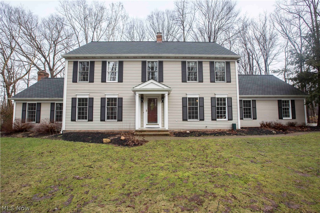 A true nature lover’s paradise, this home is nestled on 12.5 wonderfully wooded acres with tons of updates, special features, and breathtaking views! The open layout inside & fantastic outdoor features makes this home ideal for entertaining all year long. The large kitchen was fully updated in 2017 with new granite counters, stainless appliances, custom Amish built solid wood cabinets, large center island, pantry, eat-in dining, and wet bar. The kitchen opens to the stunning great room w/ vaulted wood beamed ceilings, floor-to-ceiling stone fireplace, and sliding doors to the must-see deck & screened in gazebo overlooking the beautiful yard, gardens, and pool! The main floor is complete with a spacious and freshly painted living room, large laundry room, mud room with built-in storage, a full bath w/ granite and imported tile, and access to the over-sized garage w/ lots of storage. The second floor offers a vaulted master suite with a walk-in closet & master bath with double sinks, large soaking tub, and walk-in shower. Three additional bedrooms are found on the second floor w/ fresh paint & new ceiling fans, along with a third full bath with new vinyl plank flooring, toilet, and paint. Plus brand new A/C (Feb 2019), whole house generator, new propane tank, new filtration system for the pool, and access to the Chagrin River! All of this and more in a must-see setting not far from arterial roads, golf courses, parks, private & public schools, and picturesque Chardon Square!