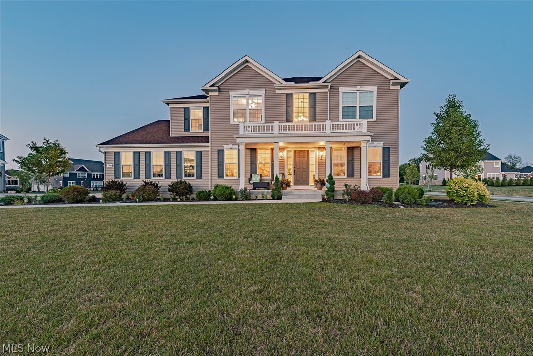 Fall in love with this stunning newer construction colonial in Hudson! This charming home features an open floor plan, a gorgeous kitchen, and an additional 50k in upgrades after being built. As you step inside the foyer, you will find the formal dining room on your left and the living room to your right. The family room features a cozy fireplace and is open to the kitchen, which features gleaming hardwood floors, granite counters, stainless steel appliances, and a sunny eat-in area with deck access. A bonus sitting area and a half bath complete the first floor. Upstairs, you are sure to love the master suite, which includes a lovely en suite bath with double sinks, a step-in shower, a soaking tub, and a walk-in closet. A guest suite with a private full bath, two additional bedrooms, a full bath, a convenient laundry room and a bonus loft area round off the second floor. The finished lower level includes a spacious rec room with a gorgeous wet bar, a fifth bedroom, a full bath, and ple