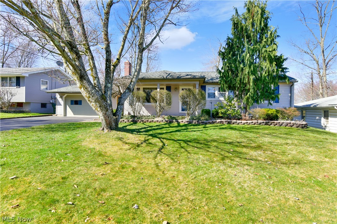 PHENOMENAL UPDATED 3-4 Bedroom Home with AMAZING Back Family Room Addition.  Home Features Include:  Large Front Living Room with Hardwood Floors/or Formal Dining Room, HUGE Back Family Room Addition with Brick Gas Fireplace, AWESOME Eat In Kitchen with tons of Cabinet Space & Pantry, Master Bedroom with Double Closets, 2 other large bedrooms, & an Updated Bath with Floor to Ceiling Tile Shower & Linen Closet.  Hall offers tons of 3 closets for towels, linens, or coats.  Lower Level features the 4th Bedroom, 2nd Full Bath, Rec Room Area & Laundry Room.  Updates Include:  New Furnace -2012, New Windows - 2012, New Siding - 2012, New Hot Water Tank - 2016, New Roof - 2020, Updated Electric, & New Carpet in Back Family Room.