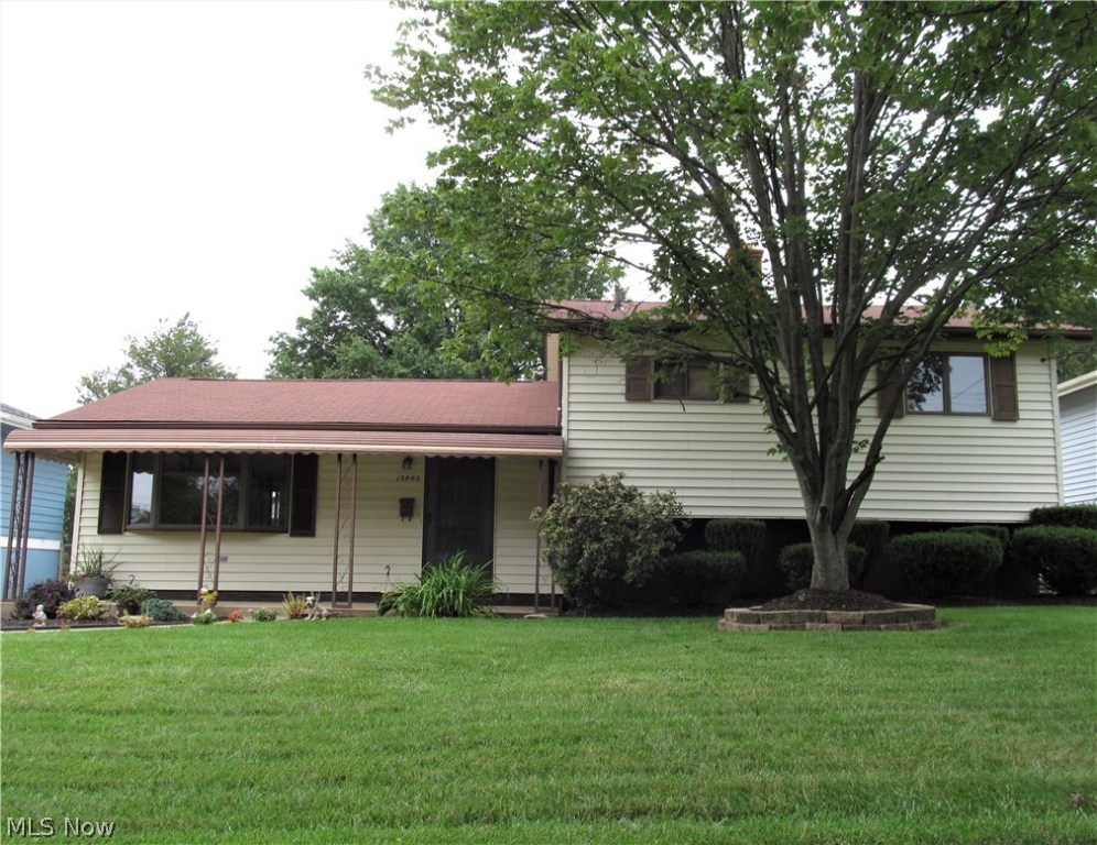 Be first or be sorry! Easy to show three bedroom, one and a half bath split on a quiet street. Immediate possession! Turn the key and move in! Eat in kitchen with plenty of oak cabinets, pantry, ceramic flooring, volume ceilings, ceramic back splash and a slider leading to a covered patio & fenced yard. Big living room with volume ceilings. Full bath updated 2018. Lower level family room has dry bar, book cases, big closet, carpet installed September 2018., laundry room, mechanical area, half bath and plenty of storage. Front covered porch. Updates include dishwasher 2018, hot water tank 2011, furnace, central air, breaker box, kitchen 2003 and driveway 2000. Includes 1 Year HMS Home Warranty!