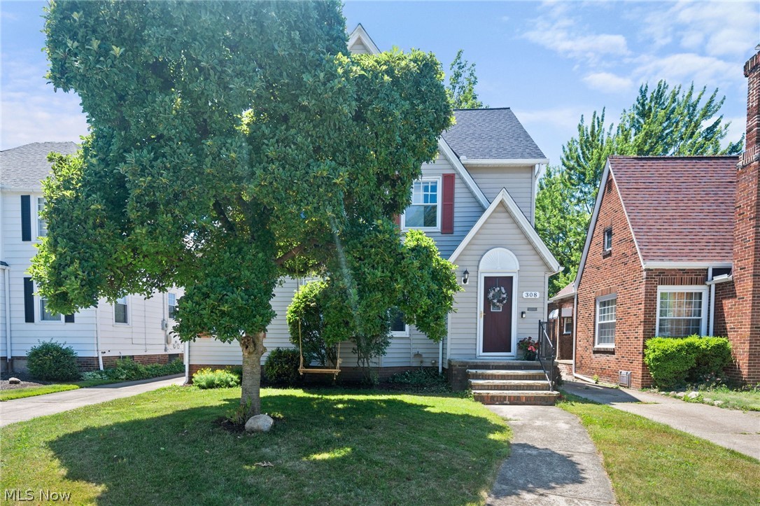 Welcome to 308 E 214th St! This charming 4-bedroom home boasts beautiful original woodwork and exquisite architectural details, ready for you to move right in. Step into the spacious, bright living room, where a large bay window and a cozy brick fireplace create a welcoming ambiance. Adjacent to the living room, you'll find a sunroom perfect for a home office or a peaceful retreat. Entertain guests in the formal dining room, complete with built-in cabinets featuring elegant glass-leaded doors. The kitchen offers ample cabinetry, a double sink, a ceramic tile backsplash, and a delightful breakfast nook. All appliances are included. A convenient half-bath rounds out the main floor. Upstairs, discover three generous, light-filled bedrooms, each with ample closet space. One bedroom opens to a sunroom that can serve as a seating area or an additional home office. The full bathroom on this level includes a spacious vanity with plenty of storage and a relaxing tub. The finished third floor expands your living space with a high-ceilinged fourth bedroom, enhanced by built-in drawers and shelves. Enjoy the outdoors in the partially fenced backyard, perfect for summer evenings and cookouts. Additional features include a detached two-car garage, providing ample parking and storage. Recent updates include a new HVAC in 2022 and a new roof in 2021. Great location close to Sims Park, Euclid Memorial Park, Municipal Golf Course, local restaurants with easy freeway access. This well-maintained home is a blend of classic charm and modern convenience, waiting for you to make it your own.