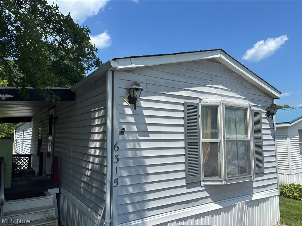 Terrific mobile home located in the Maple Del Manor community in Charlestown Township!!! 6 minutes from West Branch State Park, 9 minutes to Shaw Woods Park, 12 minutes to Windmill Lakes Golf Club, and 12 minutes to local pubs & eateries in downtown Ravenna. Great lot placement backing up to woods for added privacy. Close proximity to community playground and fishing pond with foot bridge. 1991 Fairmont Diplomat model, 2-3 bedroom, 2 full bathroom home with a total of 1120 sq ft. You'll love enjoying the weather outside on the multi level covered deck! Property includes a shed for added storage. You'll be the envy of your neighbors with 3 parking spaces out front too! Primary suite with full bathroom located on the opposite end of the home from 2nd bedroom and bathroom for added privacy. Open floor plan living space. Kitchen, with all appliances included, flows into a formal dining space. This space was originally the third bedroom. This area could easily be framed in again to serve as a bedroom depending on your needs. Convenient laundry room is just down the hall with washer and dryer included. Updates include primary bathroom toilet, vanity, & vinyl plank flooring. Electric hot water heater approximately 2024, New roof on home and shed within the last 2-3 years (25 year warranty for house roof), furnace approximately 2016.  Hurry in to grab this one before it's gone!
