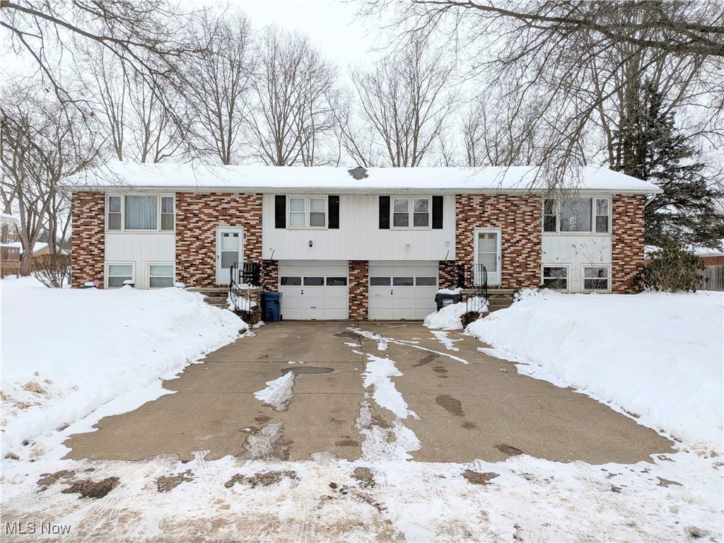 Brick duplex at 2224 Tennyson Ave NW in Massillon featuring two 2-bedroom, 1-bath units. Property is heated by a boiler system and equipped with wall A/C units. One unit is currently rented at $650 per month, while the second unit is vacant and ready to be leased, offering potential for rent increases. Tenants pay for electric, gas, and water and are responsible for lawn care and snow removal; owner for pays sewer. The basement includes an additional finished room suitable for office use, storage, or flex space. The rear yard is divided by fencing, providing separate outdoor areas for each unit. Property includes a one-car attached garage for each unit. Can be sold individually or as part of a package with MLS #5184817. This property is for investors seeking value-add potential or an owner-occupant looking to offset housing costs.